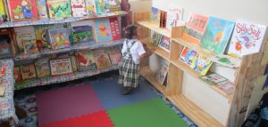 I watched as this young lady carefully examined each book. She would take one, leaf through it and then place it on the bookshelves we just built. She was still doing this when we left for another school. I asked her teacher about this young lady… and she said ‘she loves books and reading and is not surprised by her interest/dedication'.